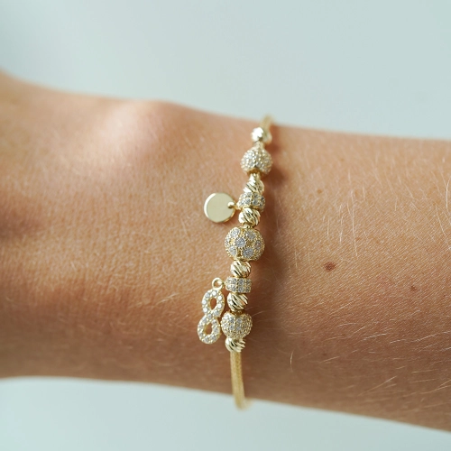 Złota bransoletka Eterna Charm próby 585