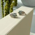 Złote kolczyki Royal Sky Blue z topazami i diamentami próby 585